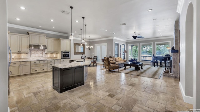 kitchen featuring stainless steel oven, cream cabinetry, visible vents, and recessed lighting