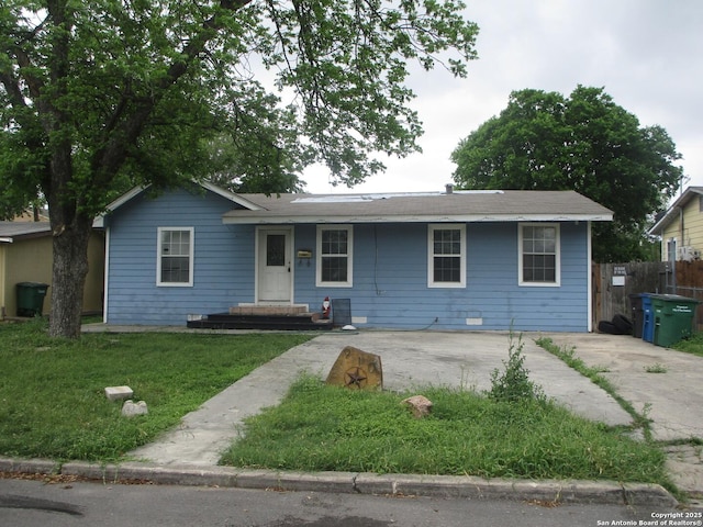 single story home featuring fence and a front lawn