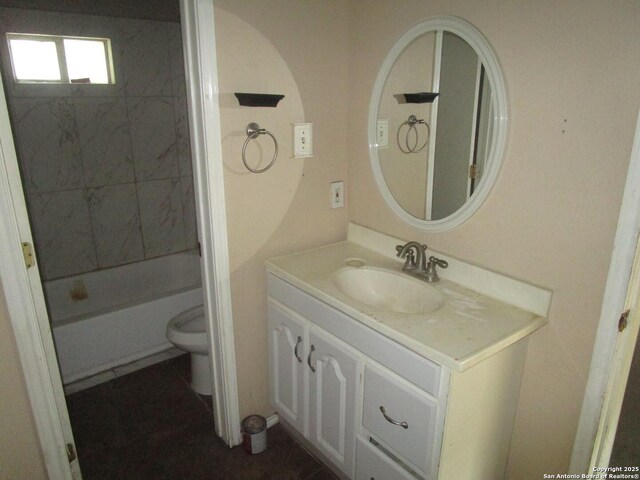 full bath featuring vanity and toilet