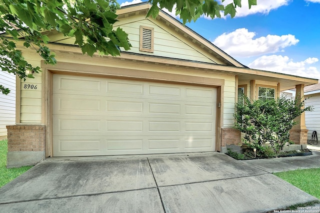 8906 Mission Brk, San Antonio, TX 78223 - garage with concrete driveway