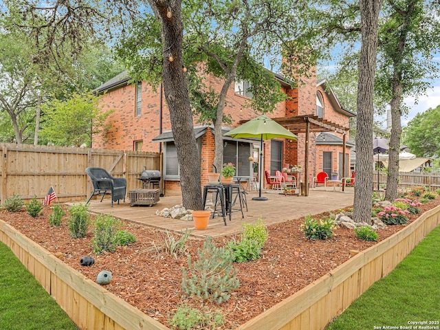 286 Iron Kettle, Universal City, TX 78148 - back of house featuring a wooden deck, brick siding, and a fenced backyard