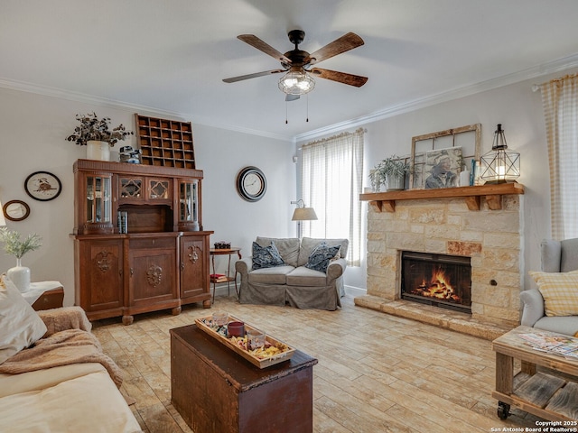 286 Iron Kettle, Universal City, TX 78148 - living area featuring a stone fireplace, crown molding, light wood-style flooring, and a ceiling fan