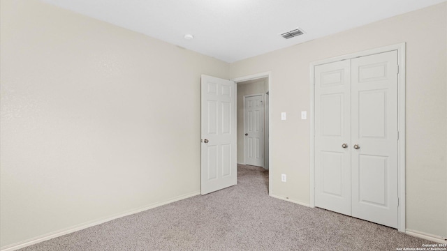 6430 Ithaca Fls, San Antonio, TX 78239 - unfurnished bedroom featuring light colored carpet, baseboards, visible vents, and a closet