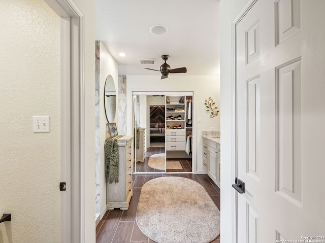 154 Elk Rdg, Canyon Lake, TX 78133 - bathroom with wood finished floors, visible vents, a ceiling fan, and vanity