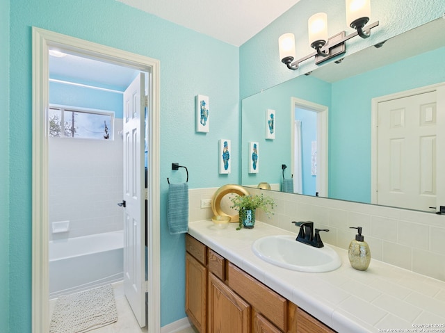 154 Elk Rdg, Canyon Lake, TX 78133 - full bathroom with a shower, vanity, decorative backsplash, and a bathtub