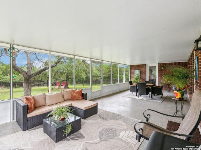154 Elk Rdg, Canyon Lake, TX 78133 - sunroom / solarium with outdoor dining area, outdoor lounge area, and a healthy amount of sunlight