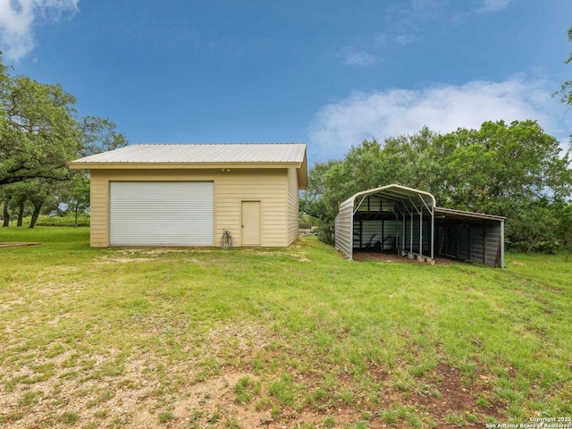 154 Elk Rdg, Canyon Lake, TX 78133 - detached garage featuring a detached carport