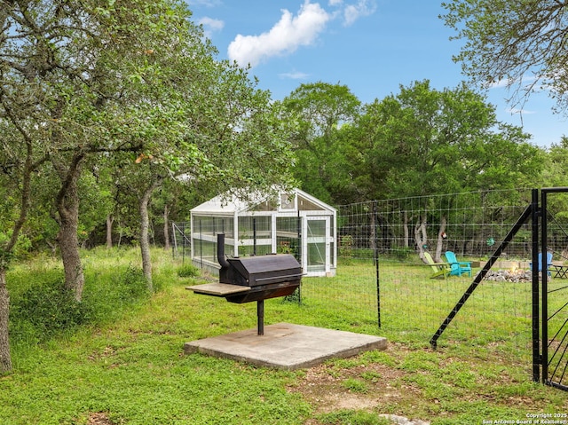 154 Elk Rdg, Canyon Lake, TX 78133 - exterior space featuring an outdoor structure, fence, and a greenhouse