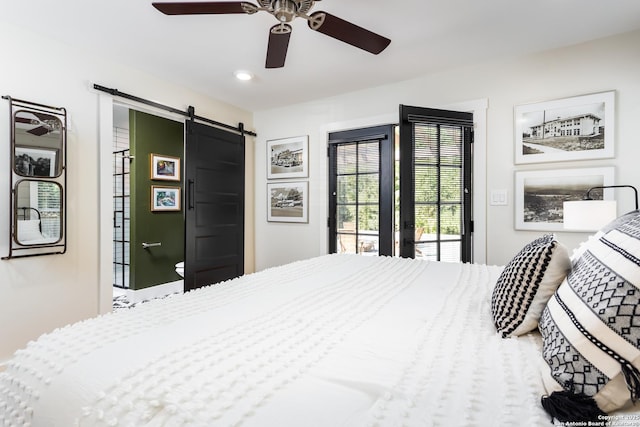 bedroom with a barn door, ceiling fan, access to outside, and recessed lighting
