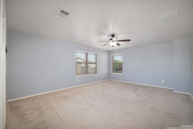 13219 Loma Sierra, San Antonio, TX 78233 - carpeted spare room with visible vents, a ceiling fan, and baseboards