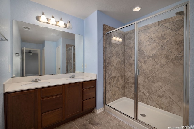 13219 Loma Sierra, San Antonio, TX 78233 - full bathroom with visible vents, a sink, and a shower stall