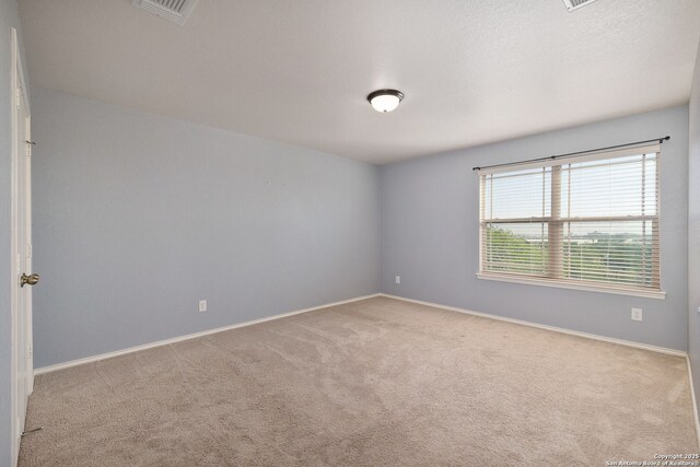 13219 Loma Sierra, San Antonio, TX 78233 - unfurnished room with visible vents, carpet flooring, and baseboards