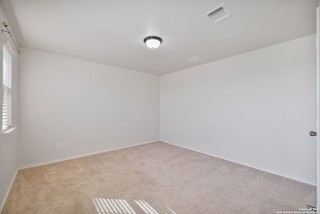 13219 Loma Sierra, San Antonio, TX 78233 - spare room featuring carpet floors, visible vents, and baseboards