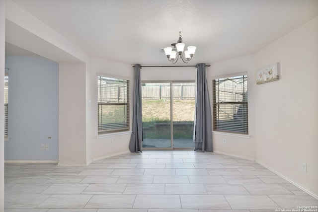 13219 Loma Sierra, San Antonio, TX 78233 - empty room featuring an inviting chandelier and baseboards