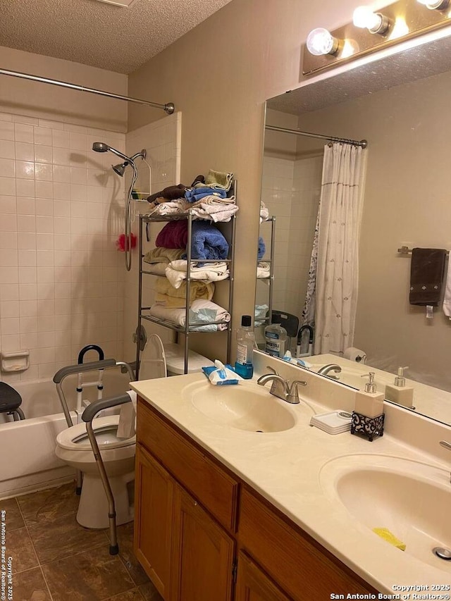 bathroom with shower / bath combo, a sink, a textured ceiling, and toilet