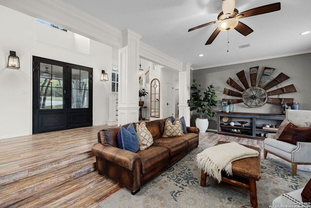 living room featuring wood finished floors, ceiling fan, decorative columns, visible vents, and recessed lighting