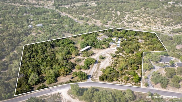 drone / aerial view with a view of trees