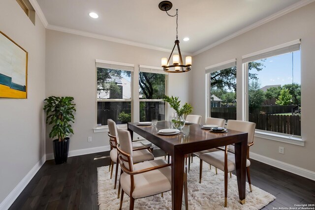 dining space featuring recessed lighting, baseboards, and a notable chandelier