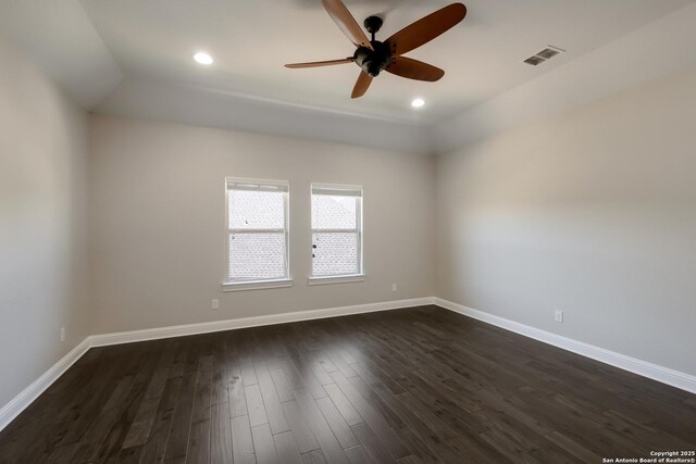 spare room with baseboards, visible vents, recessed lighting, a ceiling fan, and dark wood-type flooring