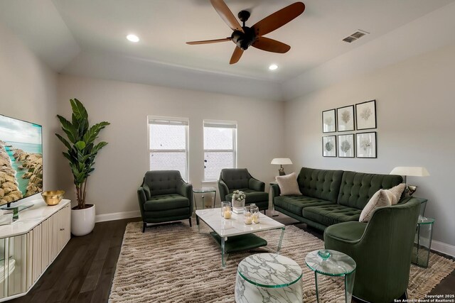 living room with ceiling fan, baseboards, dark wood-type flooring, visible vents, and recessed lighting