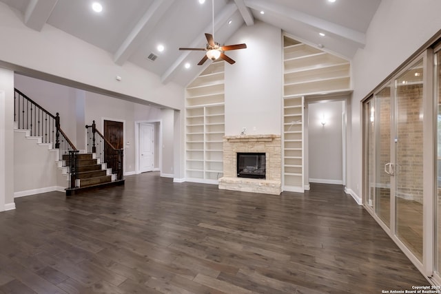 unfurnished living room featuring baseboards, stairway, and high vaulted ceiling