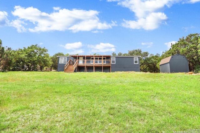 630 Nelson, Canyon Lake, TX 78133 - rear view of house featuring a lawn, an outbuilding, stairs, and a deck