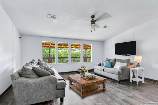 630 Nelson, Canyon Lake, TX 78133 - living area featuring wood finished floors, visible vents, and ceiling fan