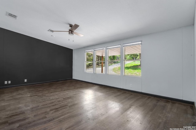 630 Nelson, Canyon Lake, TX 78133 - unfurnished room with ceiling fan, baseboards, wood finished floors, and visible vents