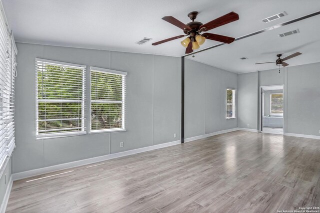 630 Nelson, Canyon Lake, TX 78133 - unfurnished room featuring ceiling fan, visible vents, and light wood-type flooring