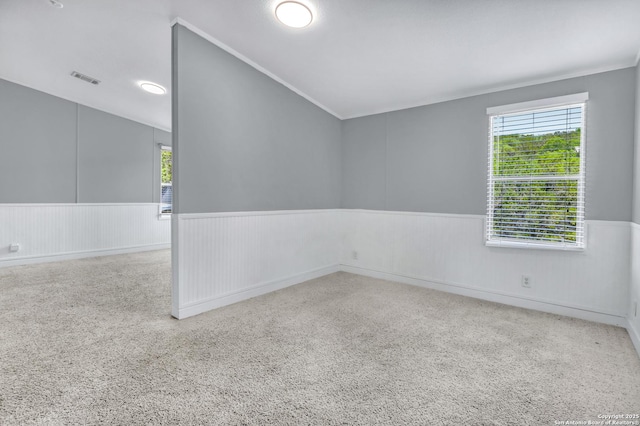 630 Nelson, Canyon Lake, TX 78133 - spare room featuring wainscoting, lofted ceiling, and visible vents