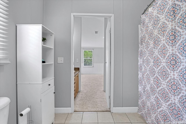 630 Nelson, Canyon Lake, TX 78133 - full bath with a shower with curtain, toilet, baseboards, tile patterned flooring, and vanity