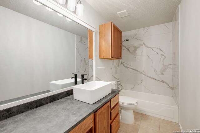bathroom with vanity, a textured ceiling, and toilet