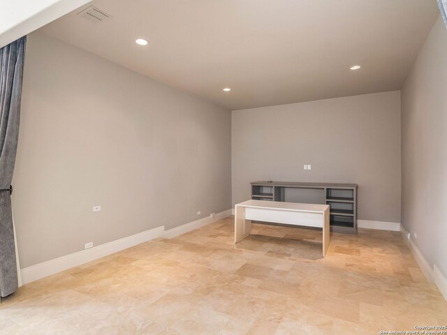 interior space with baseboards, visible vents, and recessed lighting