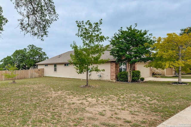 542 Snowy Egret, San Antonio, TX 78253 - view of property exterior featuring a yard, an attached garage, fence, and driveway