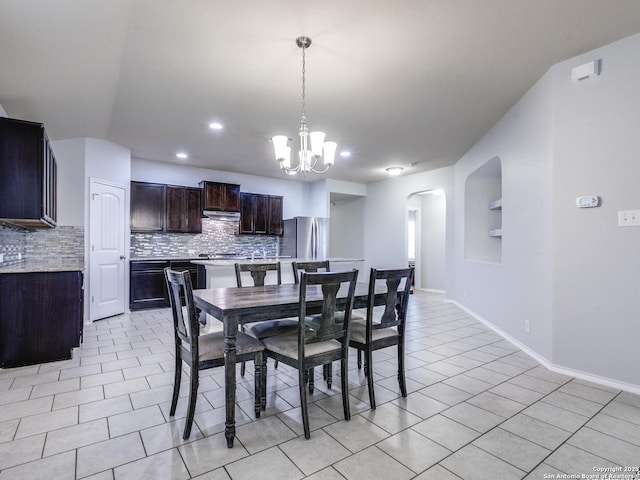 542 Snowy Egret, San Antonio, TX 78253 - dining space featuring arched walkways, baseboards, recessed lighting, a chandelier, and light tile patterned floors