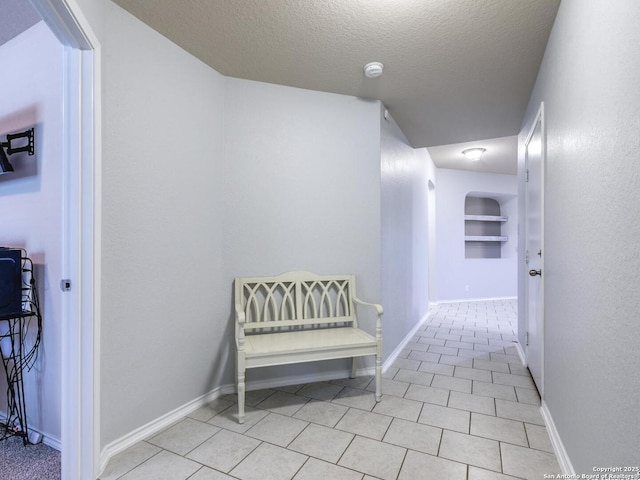 542 Snowy Egret, San Antonio, TX 78253 - corridor featuring tile patterned floors, baseboards, and a textured ceiling