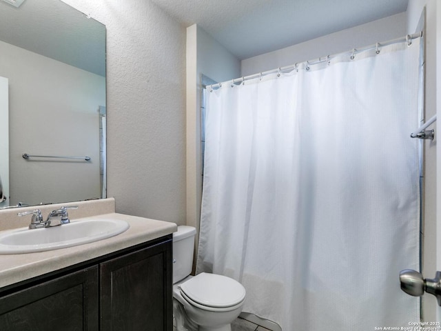 542 Snowy Egret, San Antonio, TX 78253 - full bathroom featuring a textured wall, vanity, a shower with shower curtain, and toilet