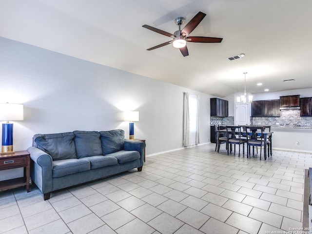 542 Snowy Egret, San Antonio, TX 78253 - living area with lofted ceiling, visible vents, light tile patterned floors, baseboards, and ceiling fan