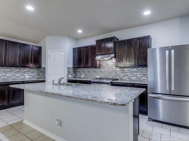 542 Snowy Egret, San Antonio, TX 78253 - kitchen with a sink, appliances with stainless steel finishes, light stone counters, under cabinet range hood, and light tile patterned floors