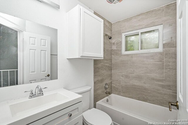 full bath featuring toilet, vanity, and shower / bath combination