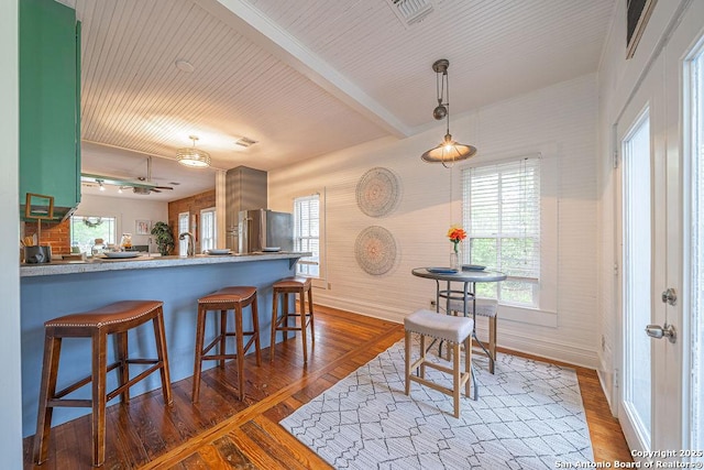 356 Kessler, New Braunfels, TX 78130 - kitchen featuring dark wood finished floors, baseboards, visible vents, and freestanding refrigerator