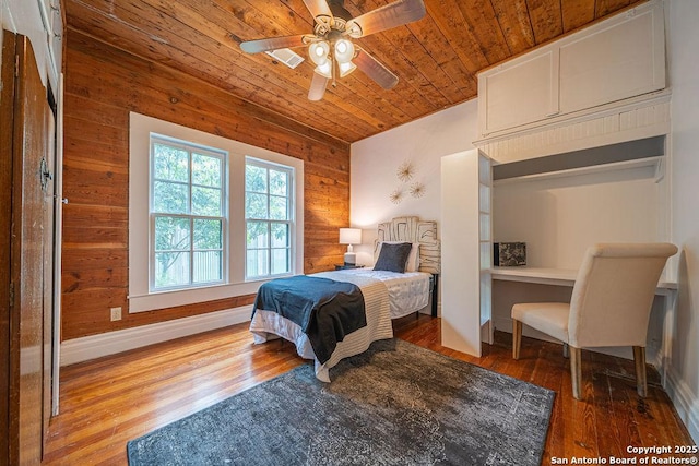 356 Kessler, New Braunfels, TX 78130 - bedroom with wood finished floors, baseboards, wooden ceiling, wood walls, and visible vents