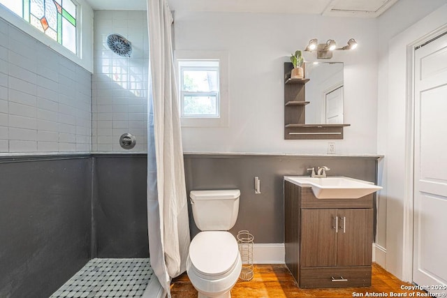356 Kessler, New Braunfels, TX 78130 - full bath featuring toilet, a healthy amount of sunlight, wood finished floors, and tiled shower
