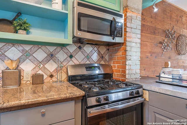 356 Kessler, New Braunfels, TX 78130 - kitchen featuring open shelves, backsplash, and appliances with stainless steel finishes