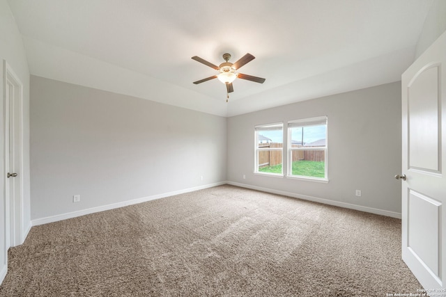spare room featuring carpet floors, baseboards, and ceiling fan