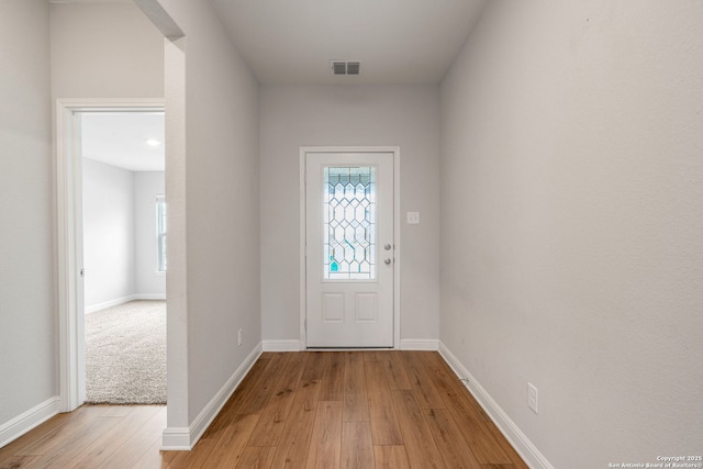 6507 Thorpe, Converse, TX 78109 - entryway with baseboards, light wood-style floors, and visible vents