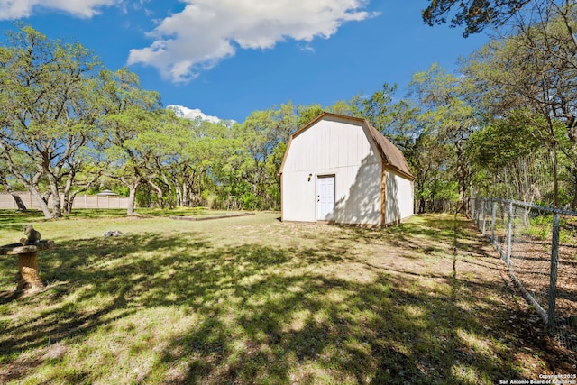 view of yard with a storage unit, fence, and an outdoor structure