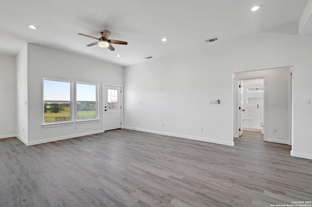unfurnished living room with recessed lighting, wood finished floors, visible vents, baseboards, and ceiling fan