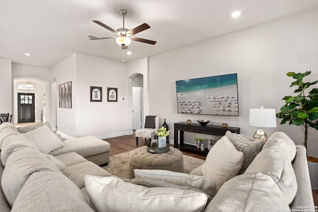 11206 Coppola, San Antonio, TX 78254 - living area with arched walkways, wood finished floors, a ceiling fan, and recessed lighting
