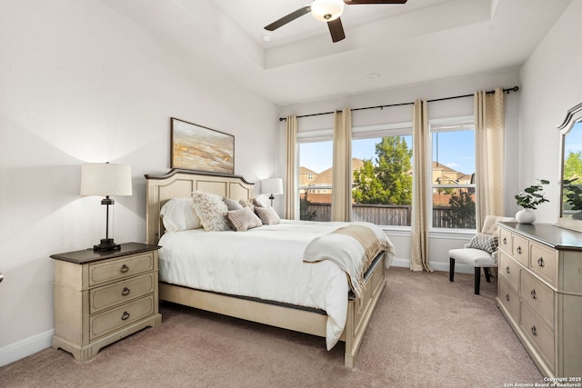11206 Coppola, San Antonio, TX 78254 - bedroom featuring light colored carpet, baseboards, a ceiling fan, and a tray ceiling